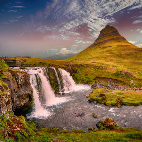 Waterfall next to a mountain